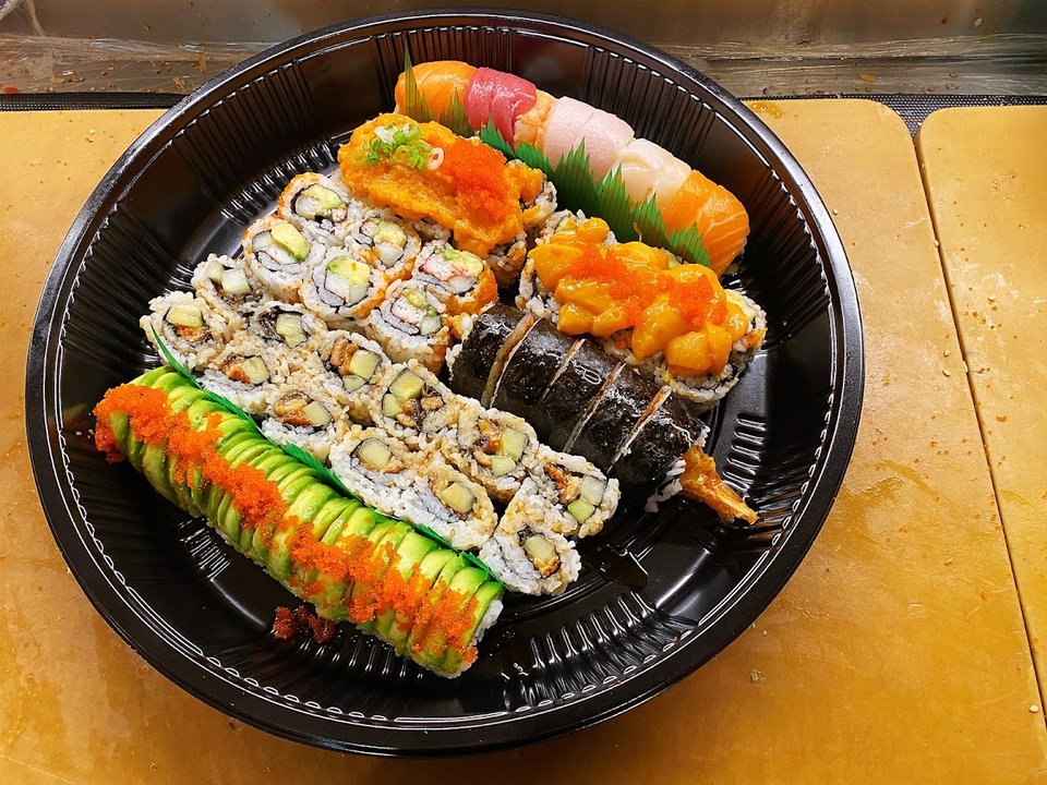 Casual dining tables inside a sushi restaurant.